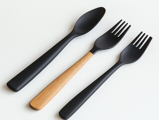 Fototapeta premium Minimalist cutlery set on a white surface.
