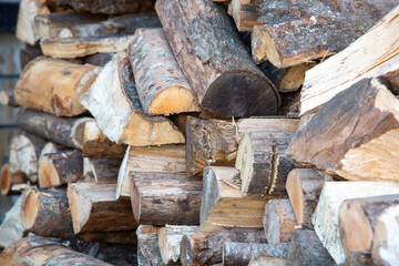 A large pile of logs stacked carefully on top of each other