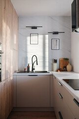 Modern kitchen design featuring stylish black faucet and sleek cabinetry