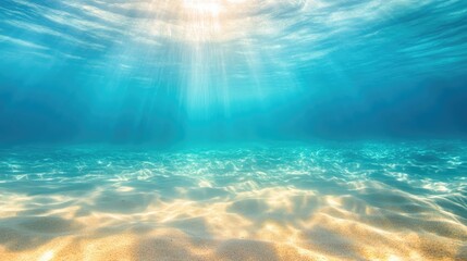 Fototapeta premium Tranquil underwater scene with shimmering aqua sea water and sun rays penetrating the surface creating a serene aquatic atmosphere.