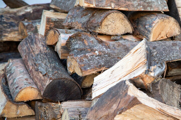 A large pile of logs stacked carefully on top of each other