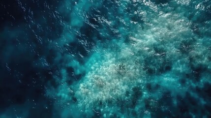 Obraz premium Aerial view of tranquil sea water surface reflecting sunlight with ripples and waves creating a serene natural background.