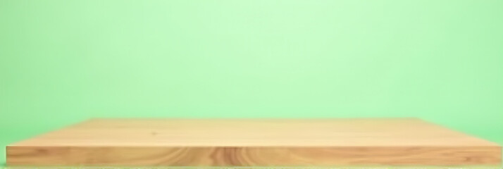 A minimalist design featuring a wooden table with an empty surface set against a soft green pastel colored background._00001_