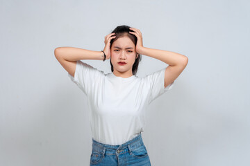 Portrait of young Asian woman isolated on white background feeling frustrated with helpless face...