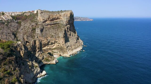 Aerial view of the wonderful Cala del Moraig and Cala de los Tiestos, located between the beautiful cliffs of the town of Benitachell, in the Mediterranean province of Alicante, Spain.