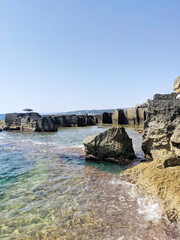 Bagno Marino Archi, cliff, sea stacks, and remains of the medieval quarries along the coast of Santa Cesarea Terme, Lecce, Apulia (Puglia), Italy.