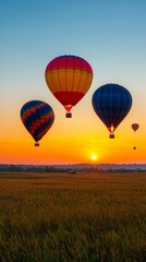 Naklejka premium Colorful hot air balloons in a scenic sunrise celebration 