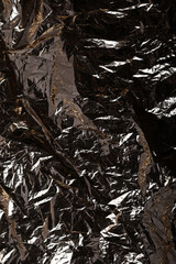 Dark Crumpled Plastic Texture Background