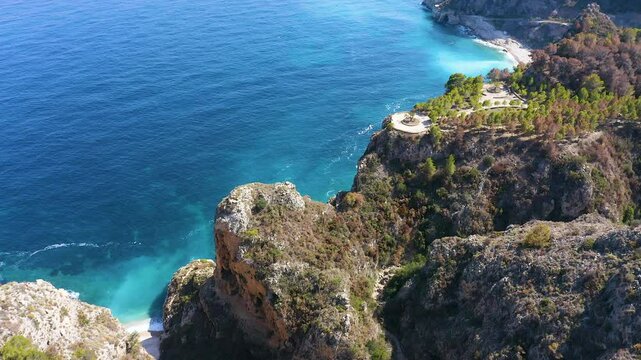 Aerial view of the wonderful Cala del Moraig and Cala de los Tiestos, located between the beautiful cliffs of the town of Benitachell, in the Mediterranean province of Alicante, Spain.