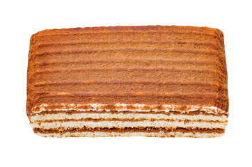 Slice of chocolate cake with milk filling, isolated on white background