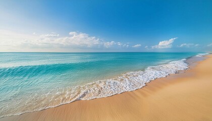 Sunny Beach With Golden Sand and Calm Waves Under Bright Blue Sky Midday