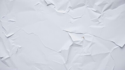 Obraz premium A close-up of a crumpled white paper poster with visible wrinkles and creases, close-up, poster, crumpled
