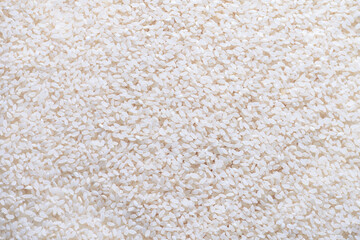 The background is made of white round grain rice.