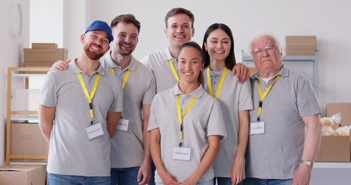 Volunteer diverse team, young, senior gathering in common team organization, happy with supervisor, community supporting, demonstrating group teambuilding together to help, guide and offer assistance 