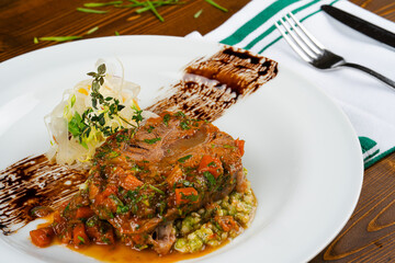 Delicious beef tenderloin. Appetizing beef tenderloin with its special carrot sauce and elegant presentation.