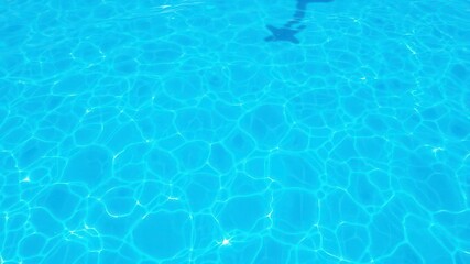 A beautiful blue water wave texture background resembling the ocean on a sunny day, surface, blue, fresh