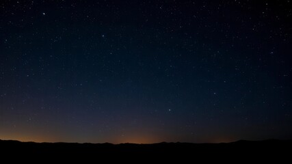 A mesmerizing starry night sky filled with twinkling stars and constellations, glittering, outdoor