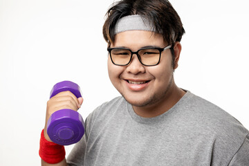 Cheerful fat man in sportswear with dumbbells in his hands. Overweight man doing sports, isolated...