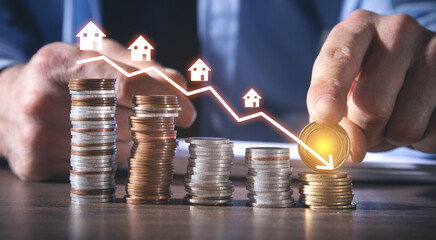 Arrow with houses. Housing market crash or decline