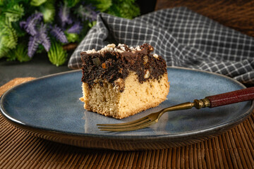 A piece of cake with poppy seeds.
