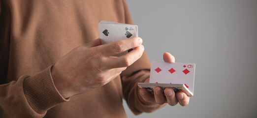 Man showing playing cards. Hobby