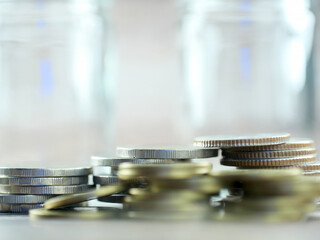 Stack of coins on blurred background in finance and savings concept.