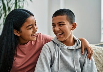 Portrait of cheerful brother and sister having fun together, showing love and complicity