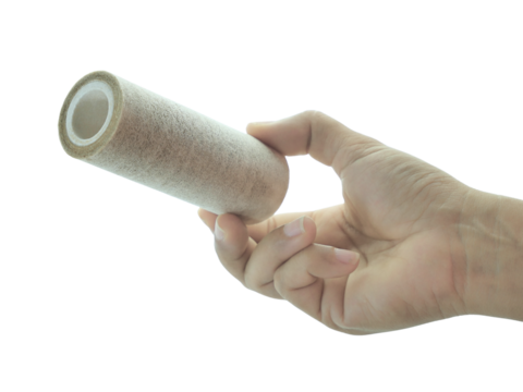 Female hand holding Used water filter isolated on white background.