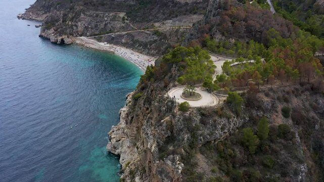 Aerial view of the wonderful Cala del Moraig and Cala de los Tiestos, located between the beautiful cliffs of the town of Benitachell, in the Mediterranean province of Alicante, Spain.