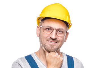 Closeup handsome construction worker with smile expressing, copy space for text, isolated on white background. Friendly repairman looking at you. Craftsman against white wall