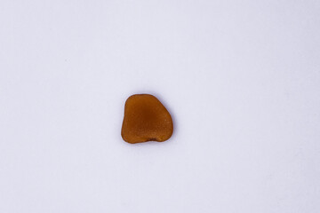 Obraz premium Stones isolated on a white background, Collection of various sea pebble stones on white background. Top view, flat lay, pebble beach isolated on white, Smooth sea rocks, colorful pebbles isolated.