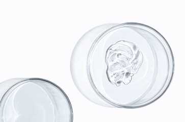 Skin serum or face wash gel in a Petri dish. For cosmetic procedures. White background