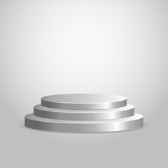 Silver podium on a grey background. Silver pedestal with stairs.	
