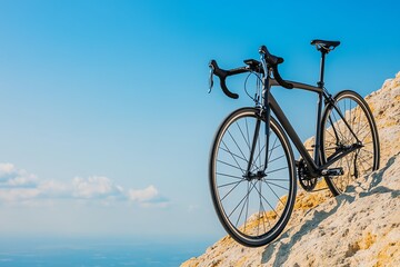 Fototapeta premium Black road bike on a clifftop