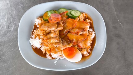 Red pork and crispy pork on rice, food in Thailand