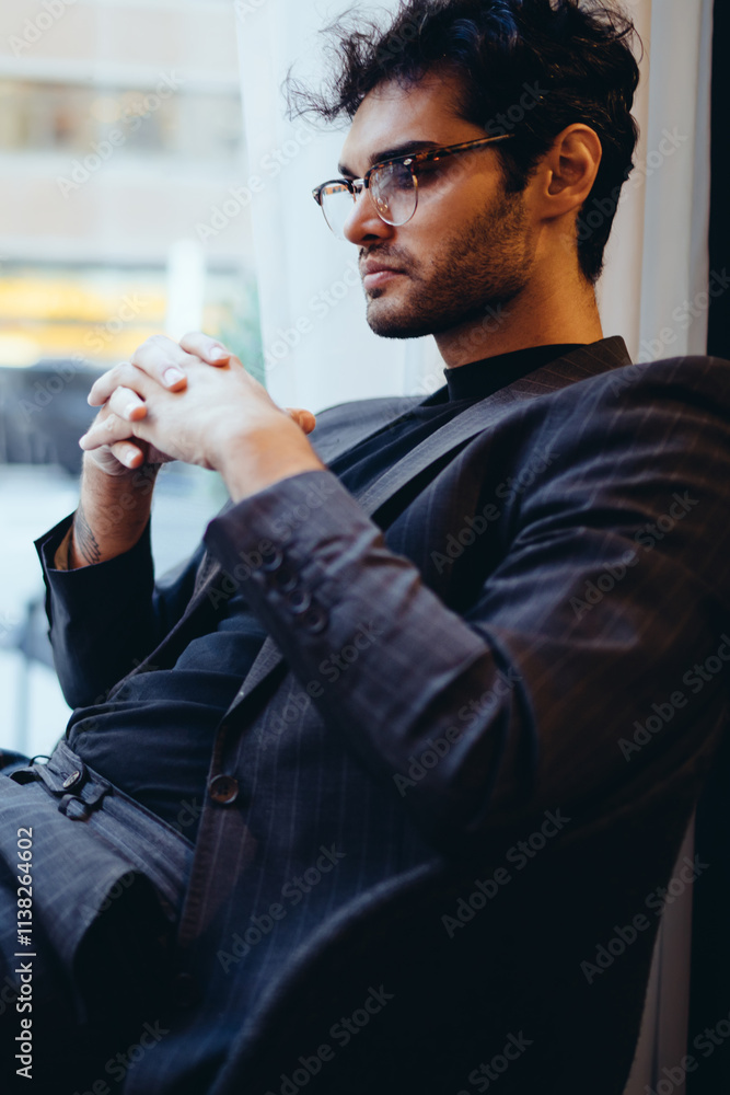 Aufkleber pensive male economist dressed in formal clothes watching tutorial via high speed internet connectio