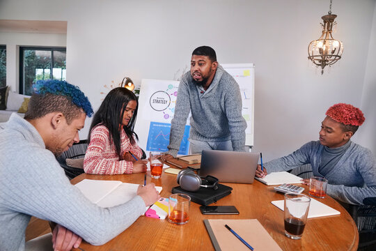 Coworkers having meeting in office