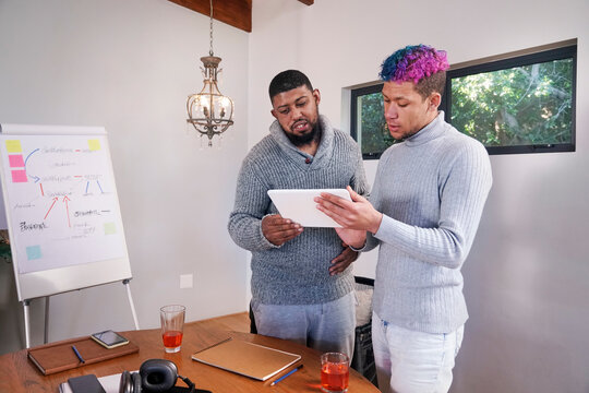 Coworkers talking in office