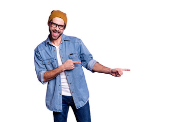 Portrait of his he nice attractive confident cheerful cheery glad bearded guy pointing two forefingers aside best ad advert copy space isolated over bright vivid shine violet lilac background