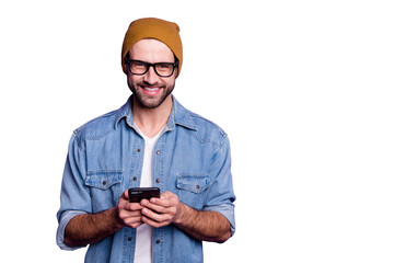 Cool handsome guy holding telephone writing friends casual denim outfit isolated violet background