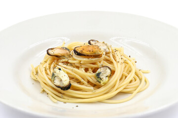 Spaghetti and clams in a plate on white background, Seafood