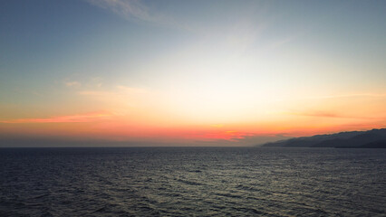 Beautiful sunset over the sea in Gorontalo, Indonesia. Panorama.