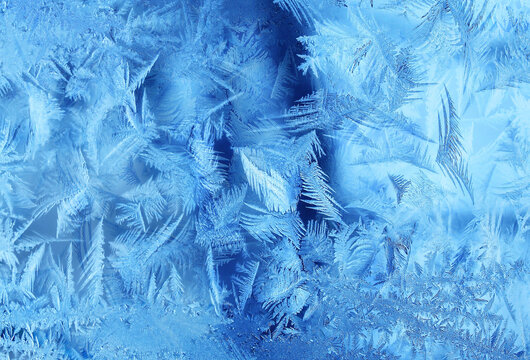 Natural frosty glass blue ice a winter close up background,  Natural frozen Pattern. Winter Abstract  freeze surface backdrop,  Texture Ice Background, Natural Blue frosty glass ice Pattern