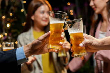 food and drink male friends are happy drinking beer and clinking glasses at a bar or pub.