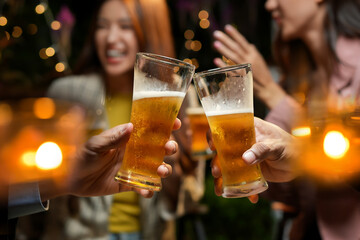 food and drink male friends are happy drinking beer and clinking glasses at a bar or pub.