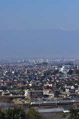 甲府盆地の桃源郷を行くE353系特急あずさ・かいじ号_2022/4/9撮影