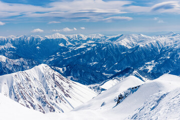 Landscape of snowy mountains, mountain range haze winter