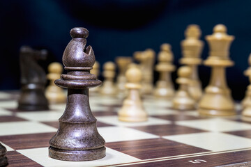 Chessmen photographed on a chessboard with a dark background