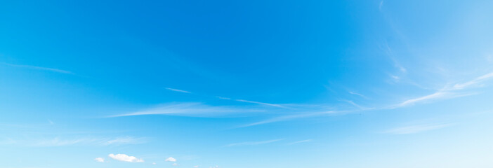 Small white clouds and blue sky
