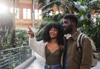 Fototapeta premium Tourists visiting atocha station in madrid, spain